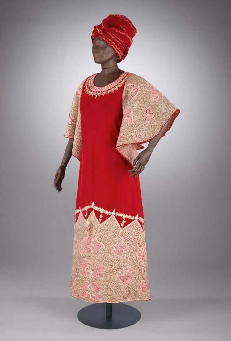 Red velvet dress and gèlè-style hat, Shade’s Boutique, 1977