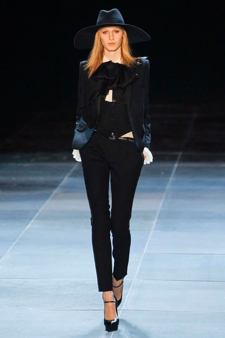 Black tailoring and wide-brimmed hat, Saint Laurent, Spring 2013 Ready-to-Wear (shown 2012)