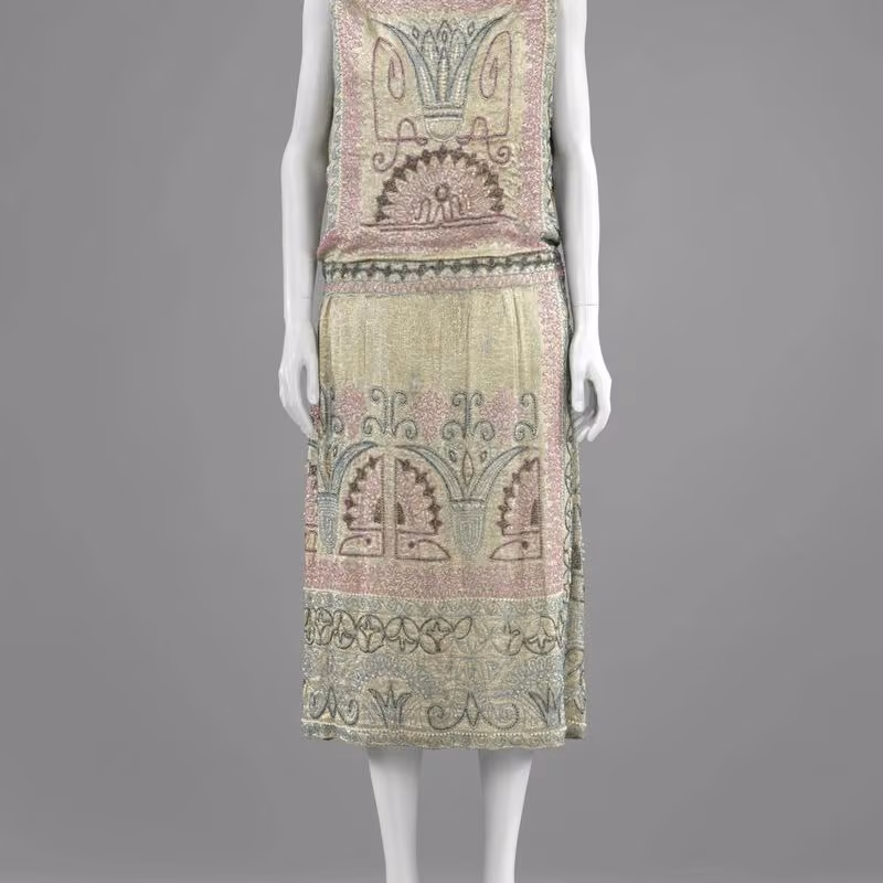 Silver-lamé evening dress with coloured beads and artificial pearls — Erté