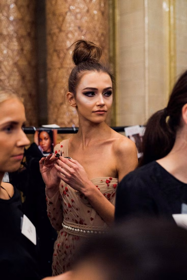 Embellished corseted pink dress, backstage photograph — Kristian Aadnevik