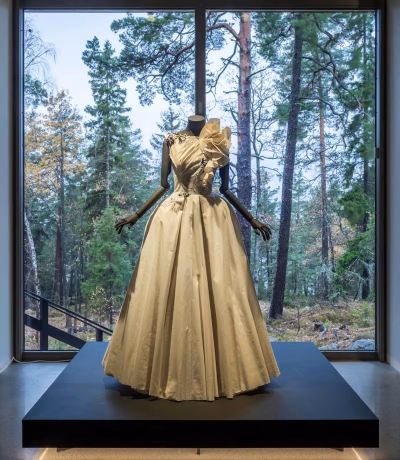 Gold full-skirted couture gown displayed in Fashion Stories — Lars Wallin
