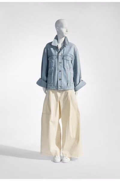 Pale denim jacket with voluminous white trousers — Marina Yee