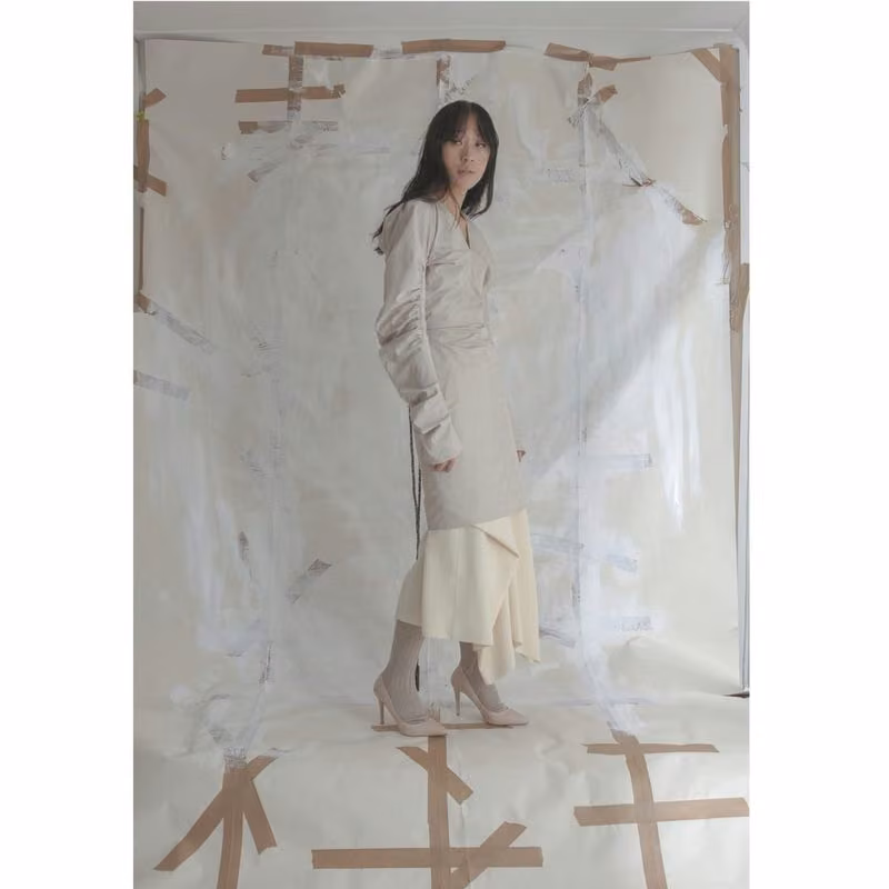 Layered pale jacket and skirt ensemble — Siiri Raasakka