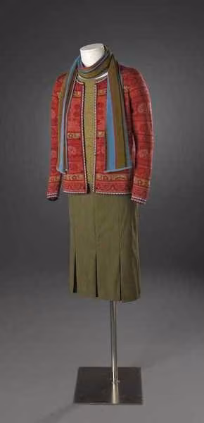 Patterned knit cardigan, striped scarf and pleated skirt — Solveig Hisdal