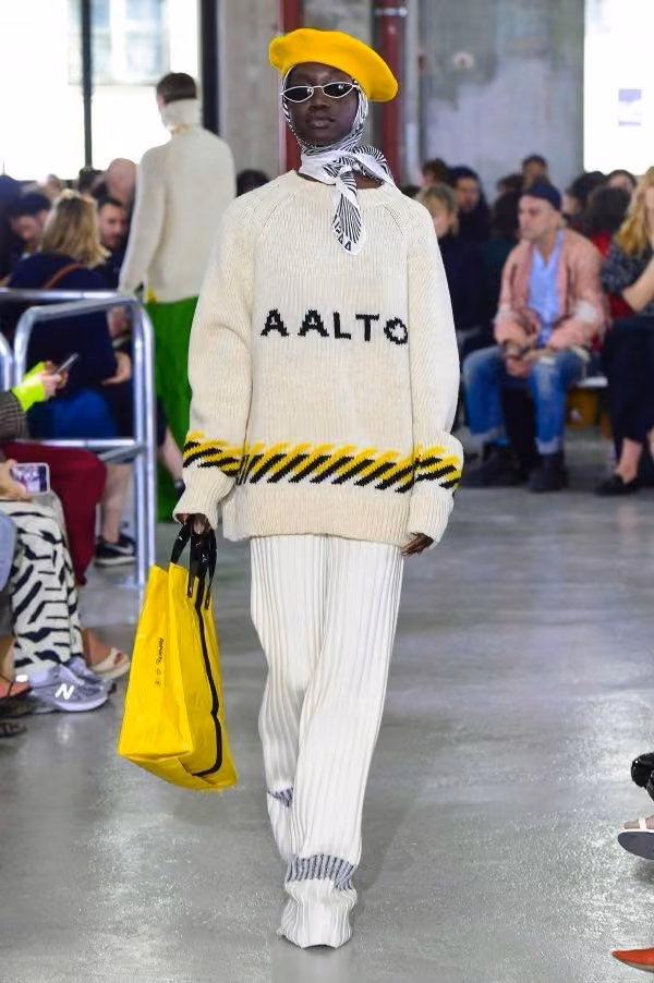 AALTO knit top and pleated pale trousers — Tuomas Merikoski