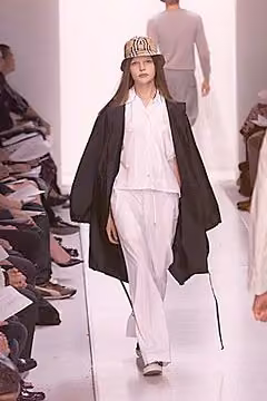 Dark long coat over white separates, Matt Nye, Spring 2000 Ready-to-Wear.