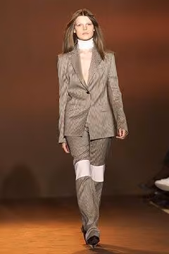 Tailored suit with pale knee panels by Richard Edwards, Fall 2002 Ready-to-Wear.