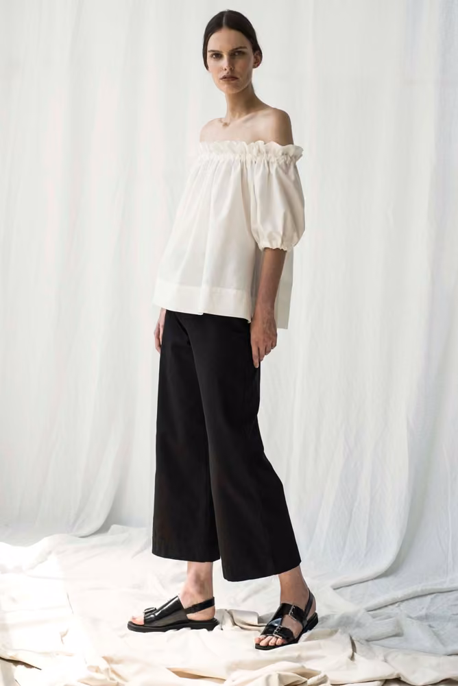 Ivory off-shoulder top and black trousers, Shaina Mote, Spring 2017 Ready-to-Wear.