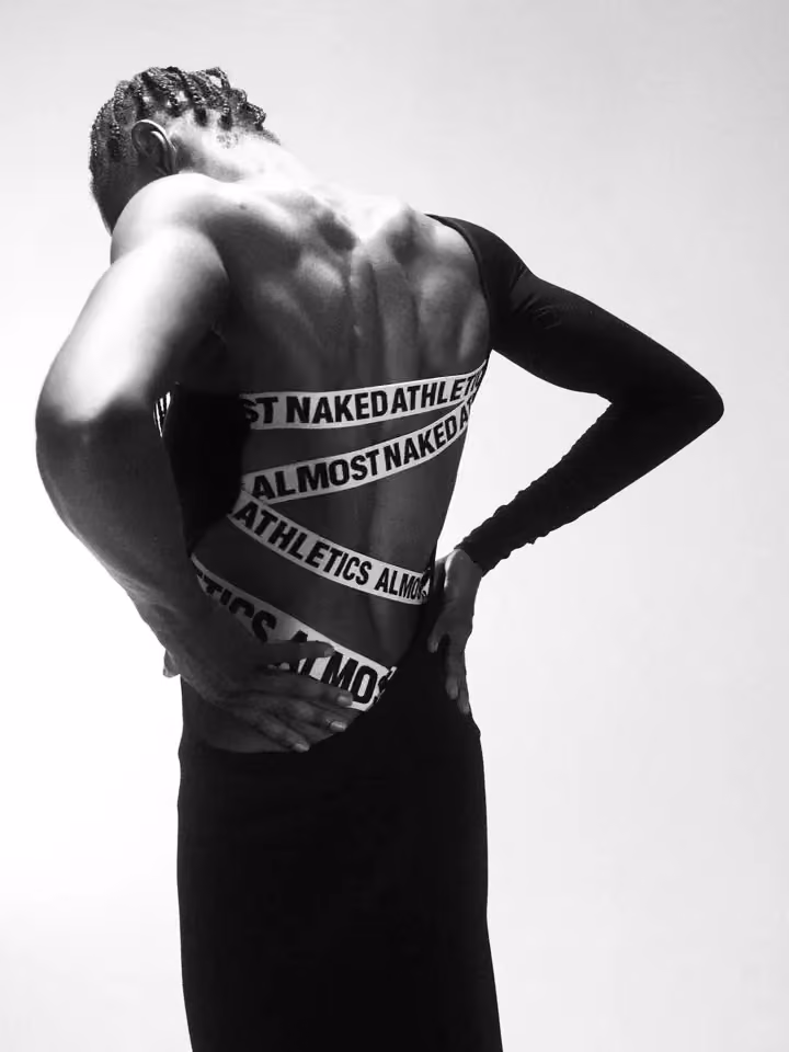 Almost Naked Athletics logo-strapped black sports top — Astrid Olsson, Date not documented