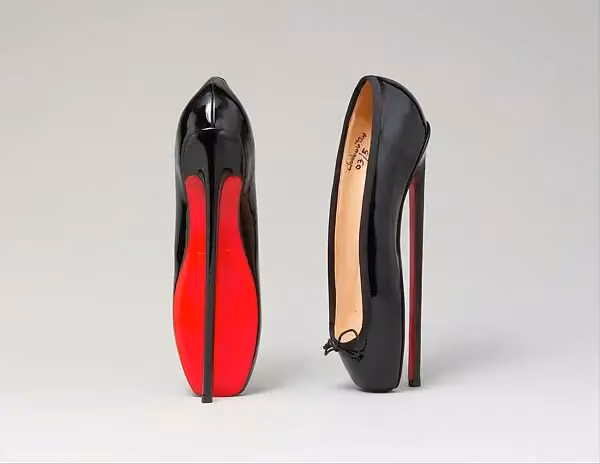 Extreme-arched red-soled pumps — Christian Louboutin, 2007