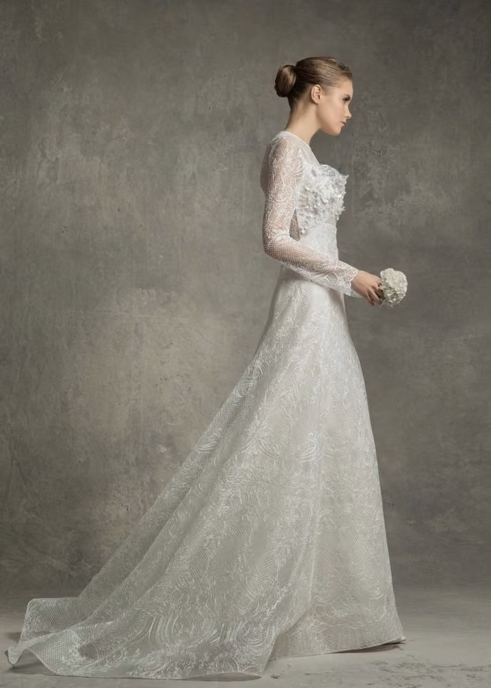 Long-sleeved lace bridal gown by Angel Sanchez, Bridal Spring 2017.