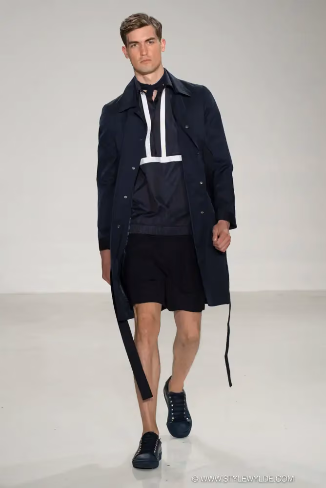 Navy coat over a contrast-trim pullover and shorts — Carlos Campos, Spring/Summer 2017