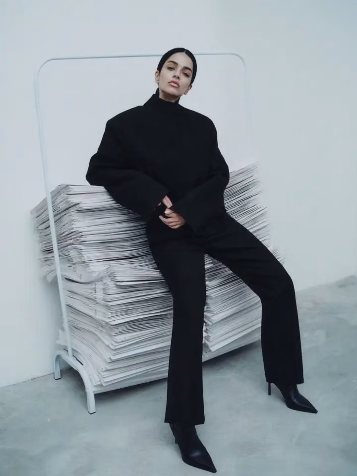 Black tailored asymmetric jacket and flared trousers — Ahmed Hassan, Date not documented