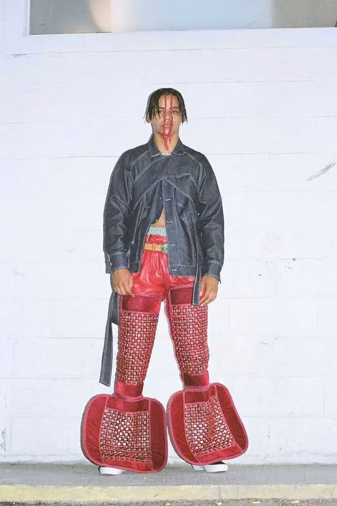 Black jacket with woven red leg structures — Bárbara Sánchez-Kane, Spring/Summer 2018 — Men Without Fear