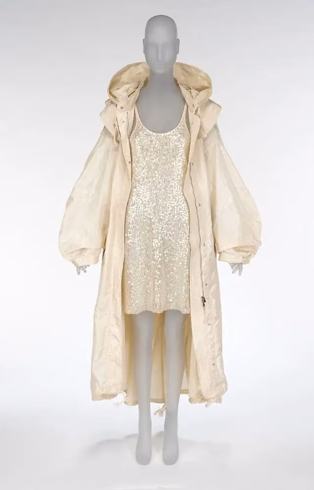 "BioSequin" dress and "Protein Evolution" parka — Stella McCartney, 2023