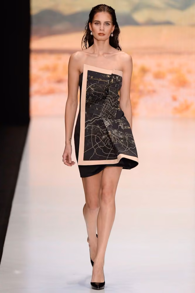 Black map-print strapless minidress by Dasha Gauser, Russia Spring 2017.