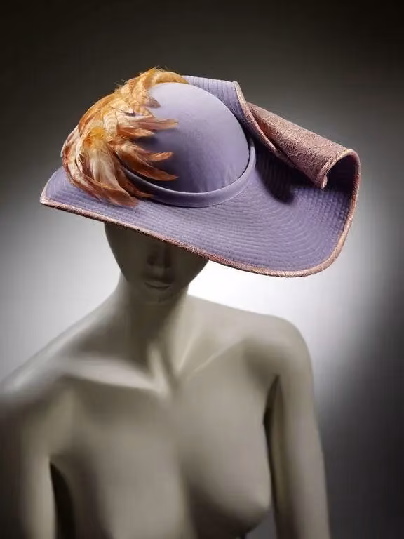 Lilac velvet hat with a scrolling brim — Stephen Jones, 1982