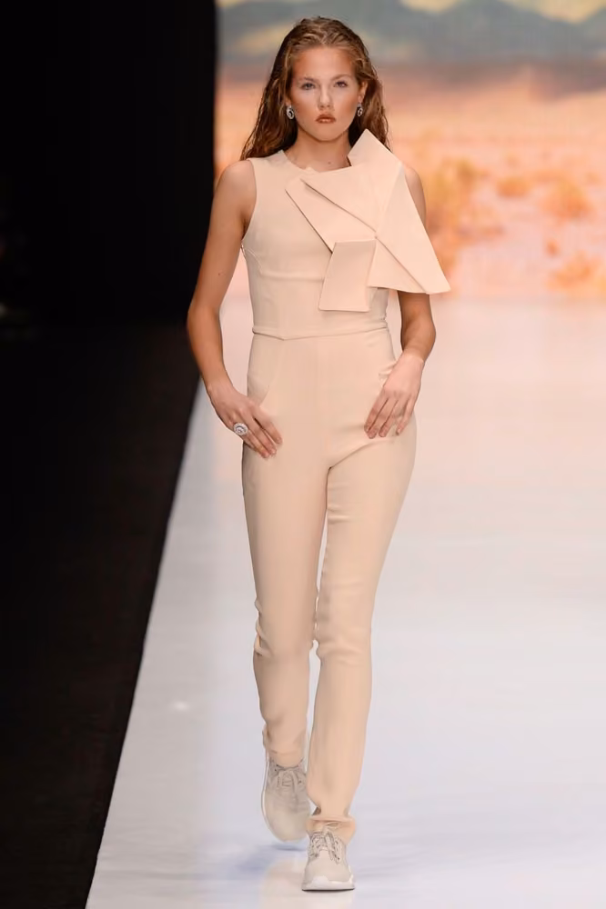 Pale asymmetric ruffled jumpsuit by Dasha Gauser, Russia Spring 2017.