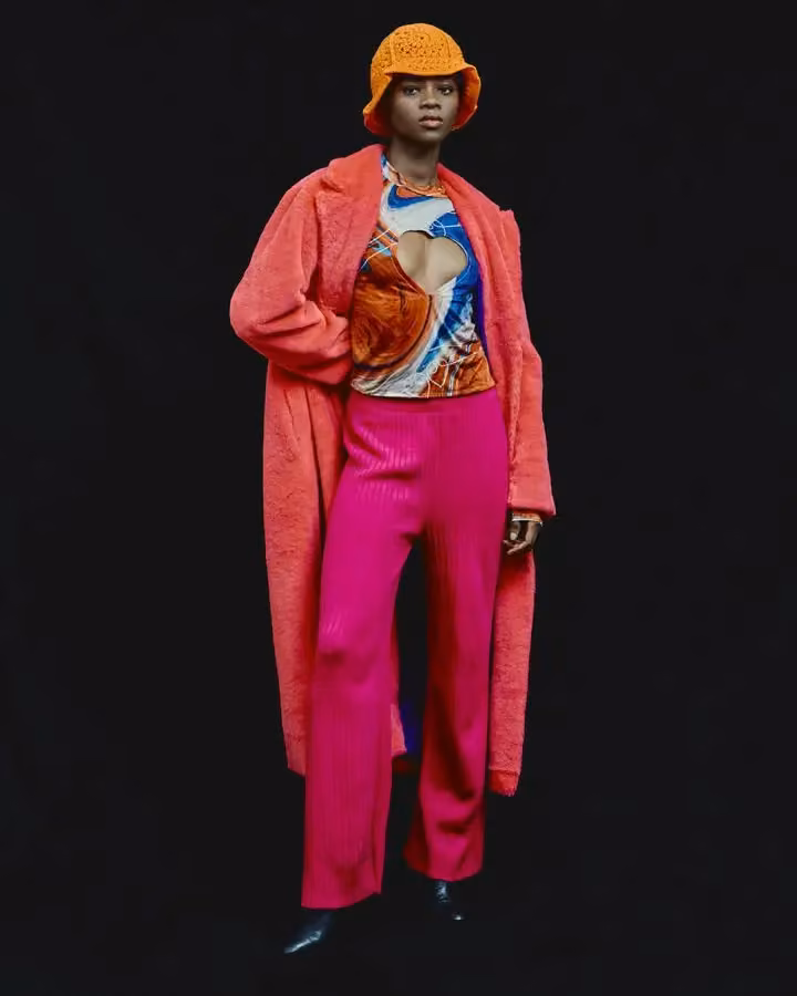 Coral coat with pink trousers and an orange hat — Adebayo Oke-Lawal, Presented 2024