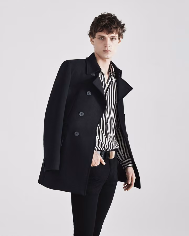 Black peacoat and striped shirt by Jeffrey Rüdes, Fall 2017 Menswear.