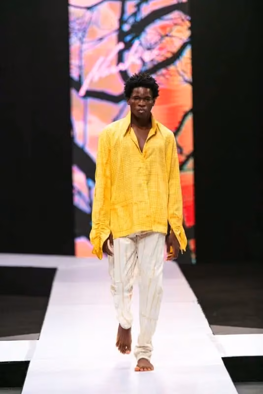 Niuku — Yellow shirt and pale trousers — Kadiata Diallo, 2021