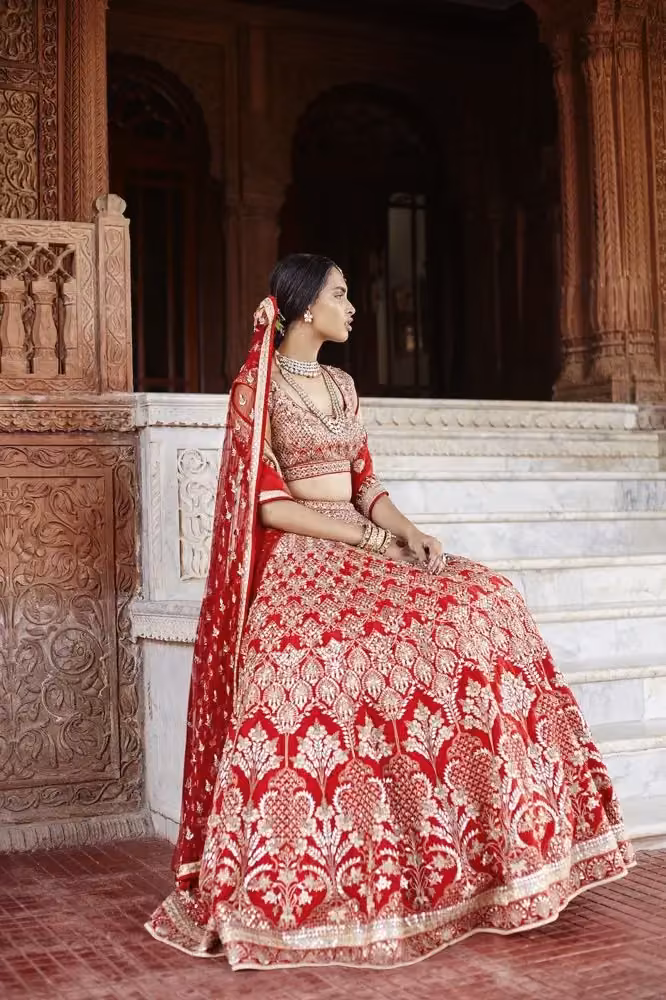 Red embroidered lehenga ensemble — Anita Dongre, Date not documented