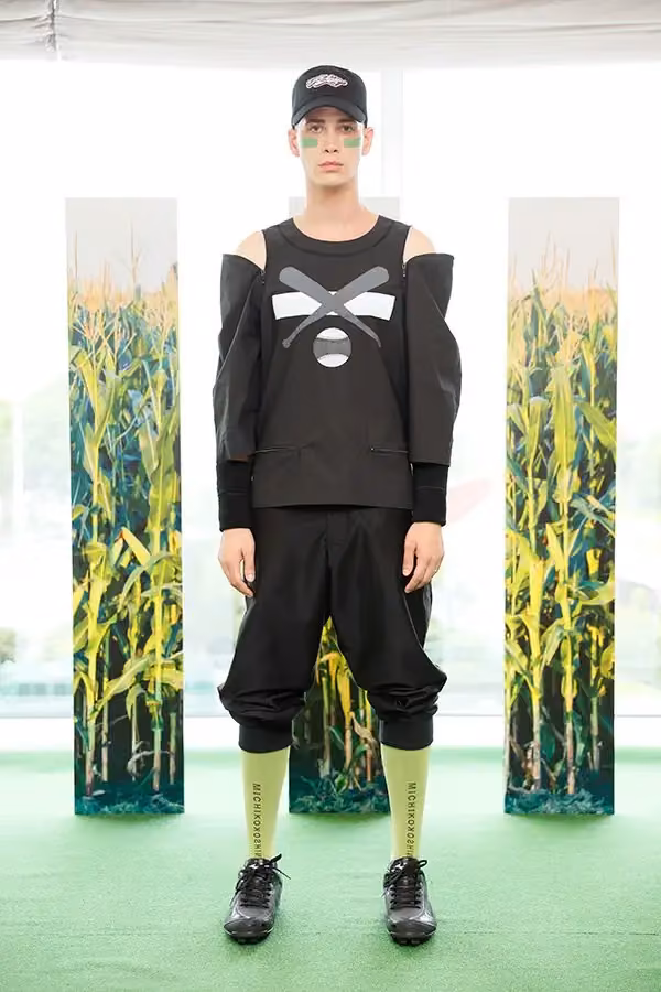 Black cutout sweatshirt with cropped trousers — Michiko Koshino, Spring/Summer 2018