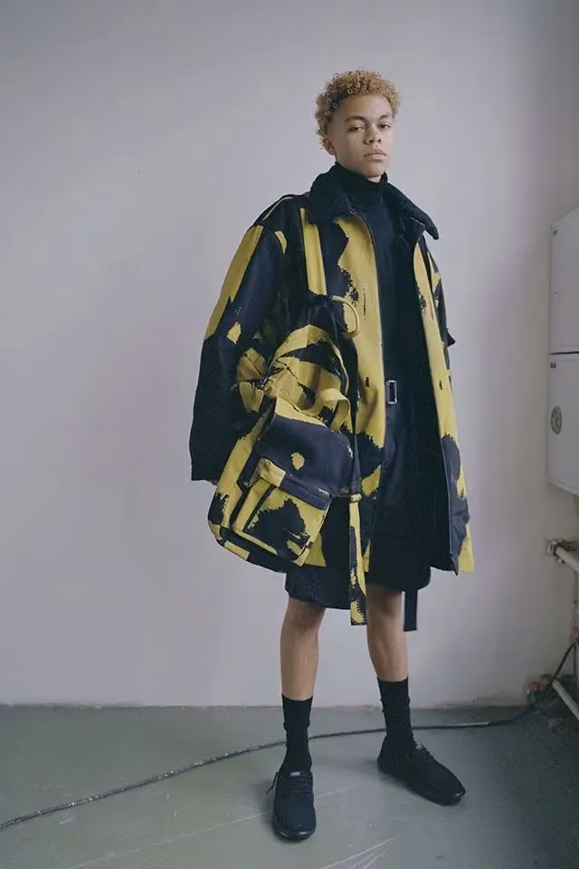 Yellow-and-black printed parka and shorts for R-Collection — Maria Korkeila, 2018; previewed December 2017