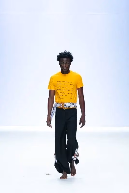 Bloke — Yellow knit top and black trousers — Faith Oluwajimi, 2022