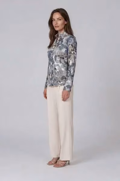 Ferrara Ziglar printed blouse with cream trousers — Camilla Thulin, Date not documented