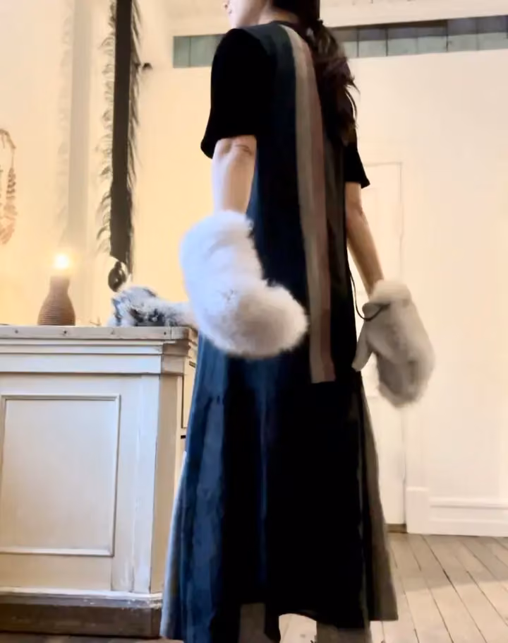 Black dress and fur mittens — Ásta Vilhelmína Guðmundsdóttir, Date not documented