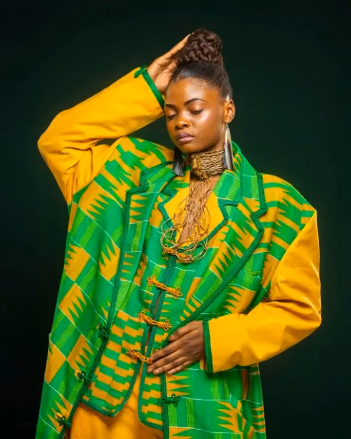 Yellow ensemble with a green patterned vest — Alphadi, 2026