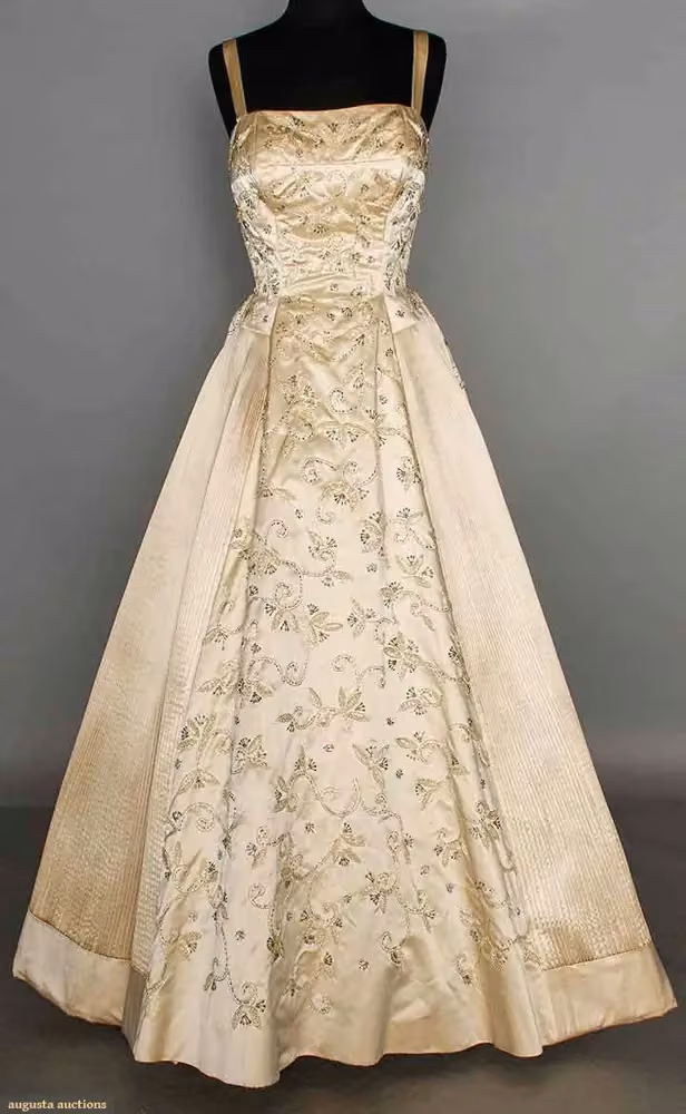 Beaded cream ballgown with pleated side panels — Maria Antonelli, 1950s