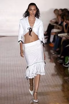 Tied white shirt and ruffled skirt by Sebastian Pons, Spring 2005 Ready-to-Wear.