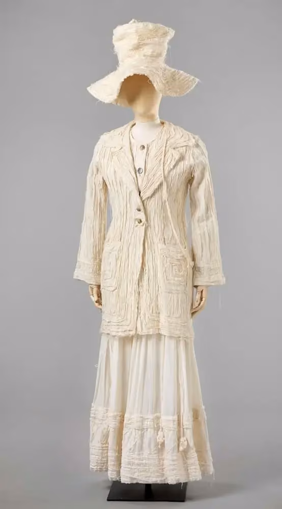 Cocoon ensemble: textured jacket, long skirt and sculptural hat — Pia Myrvold, 1993