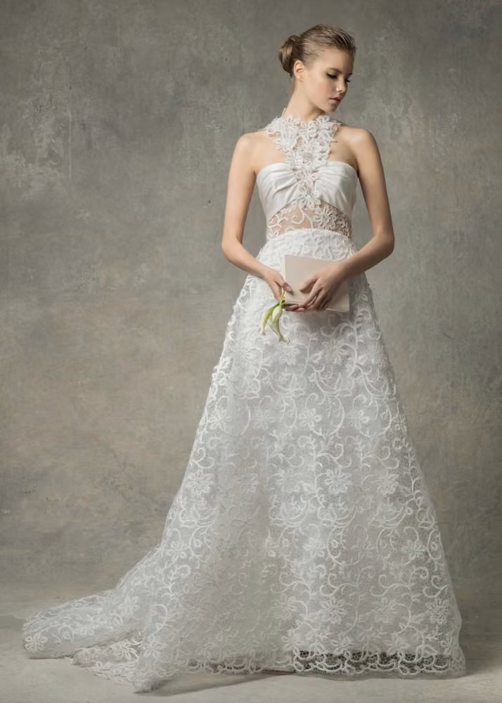 Lace gown with sculpted neckline by Angel Sanchez, Bridal Spring 2017.