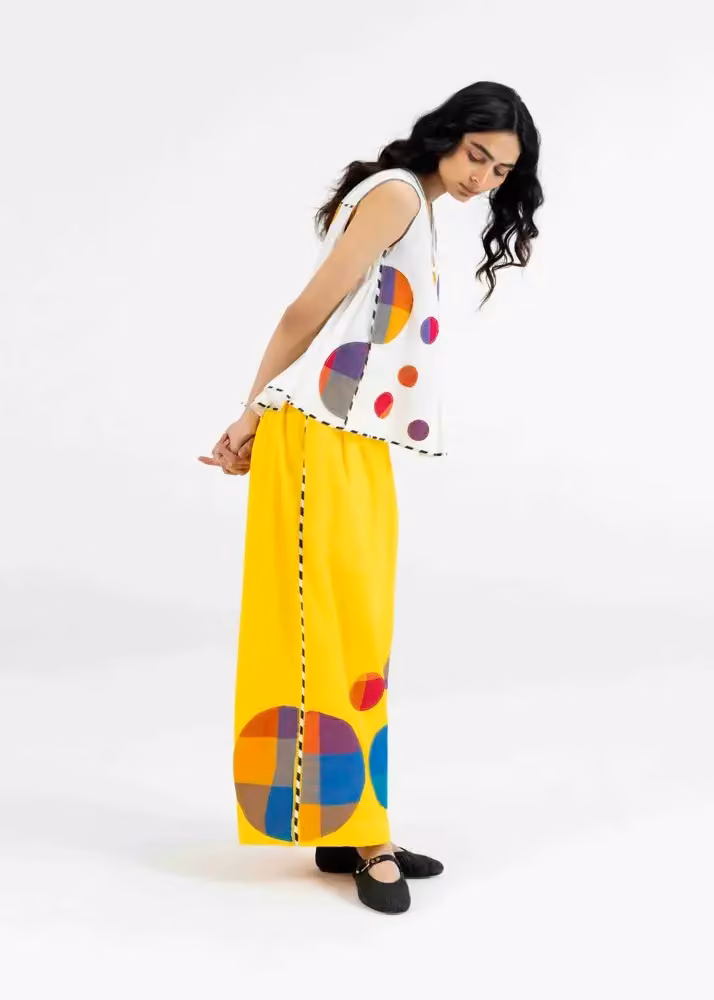 Yellow flared trousers and a printed sleeveless top — Abu Jani & Sandeep Khosla, Date not stated