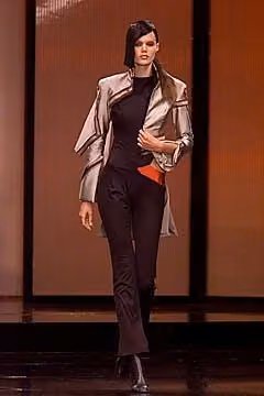 Metallic jacket over dark separates by Tristan Webber, Spring 2001 Ready-to-Wear.