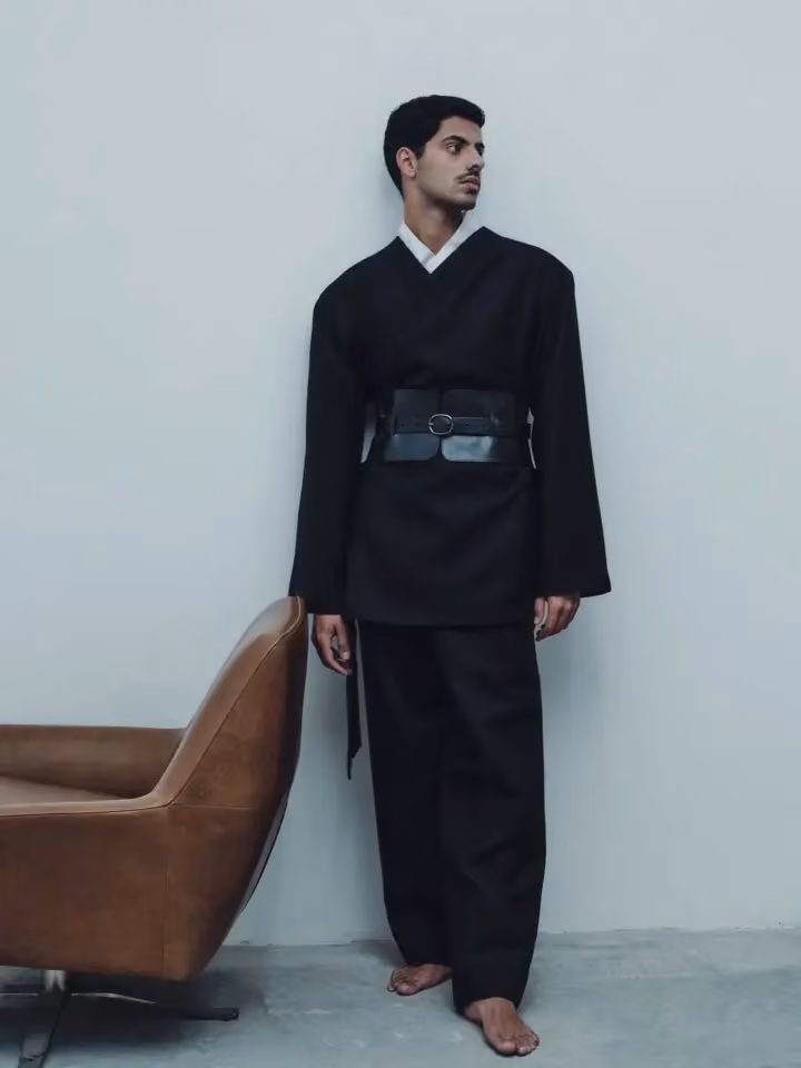 Black belted tailored ensemble — Ahmed Hassan, Date not documented