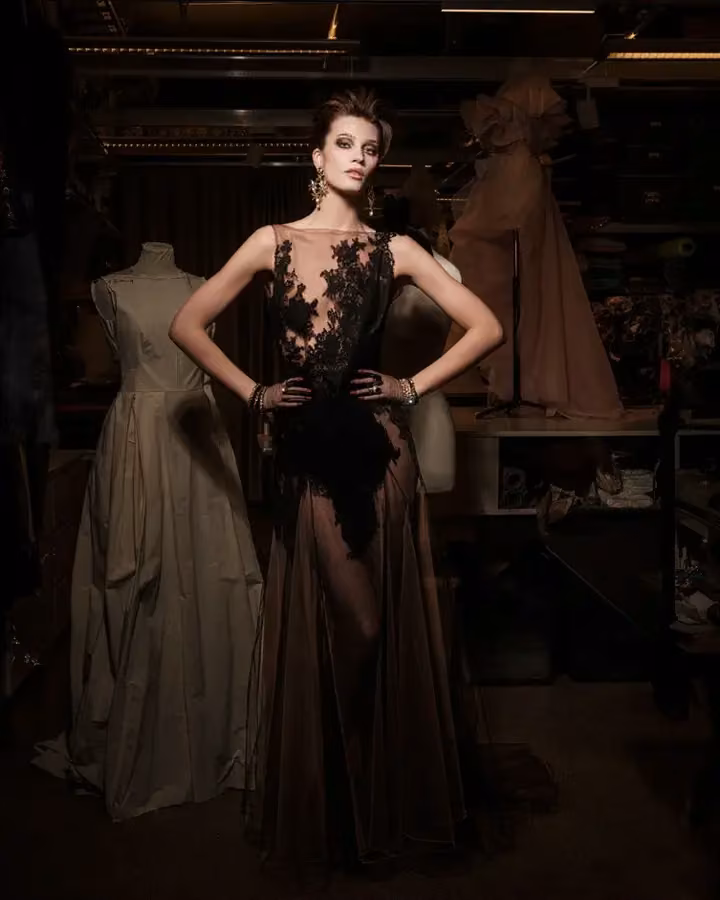 Sheer black gown with lace appliqué — Lars Wallin, Date not documented; exhibited 2024