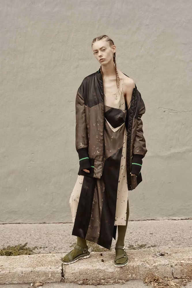 Dark oversized coat and layered dress by Josh Goot, Spring 2017 Ready-to-Wear.