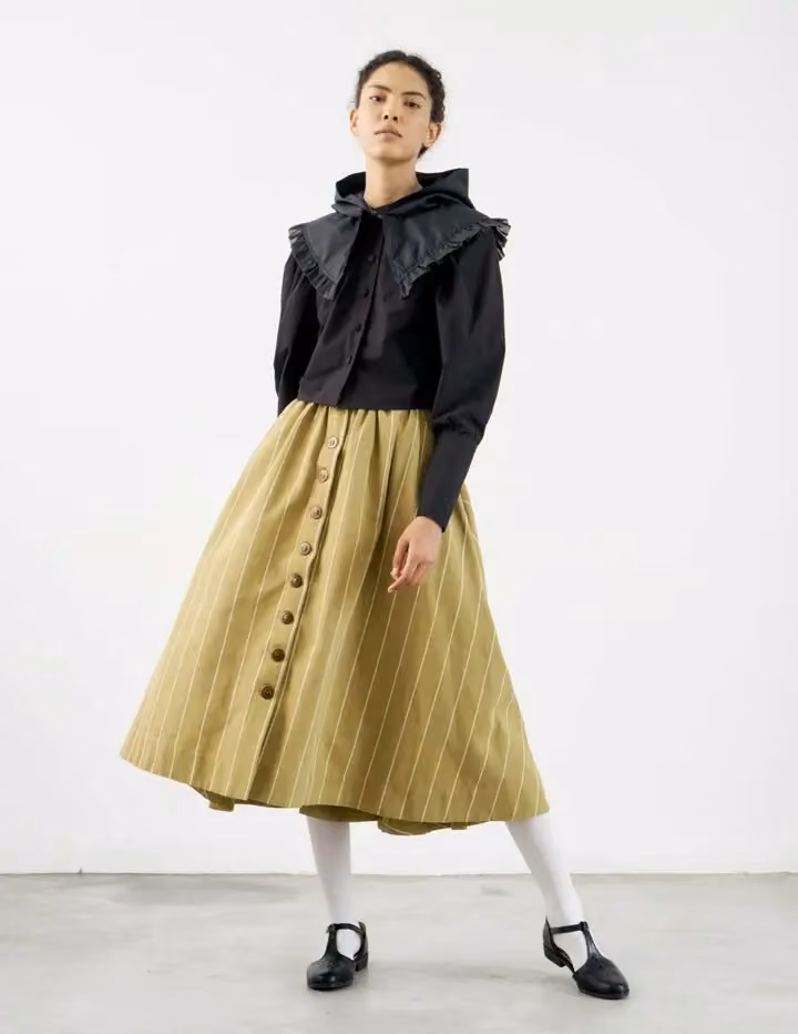 Black blouse and olive skirt — Sindiso Khumalo, Spring 2021
