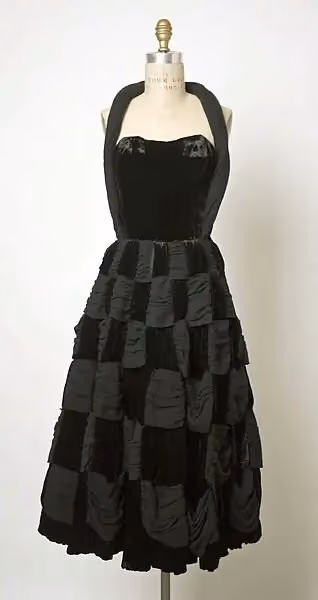 Black halter dress with a patterned skirt — Simonetta Colonna di Cesarò, 1950