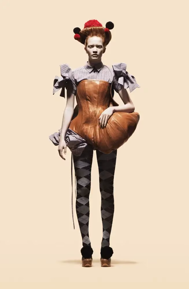 Tan sculptural corset and harlequin leggings — Astrid Olsson, Autumn/Winter 2010