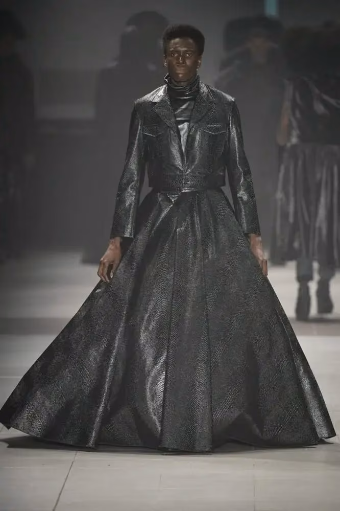 Black tailored upper garment with voluminous floor-length skirt — João Pimenta, 2022