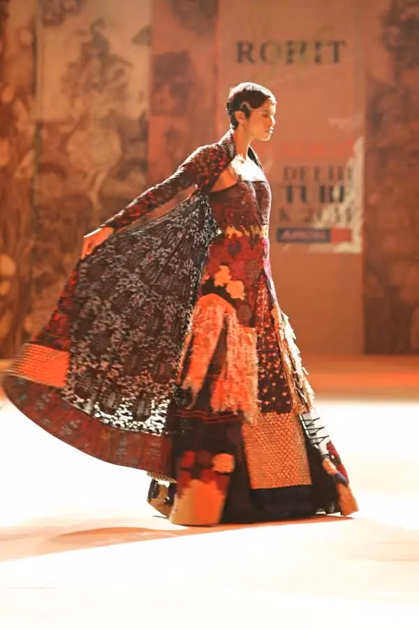 Red patterned long coat ensemble — Rohit Bal, Date not documented