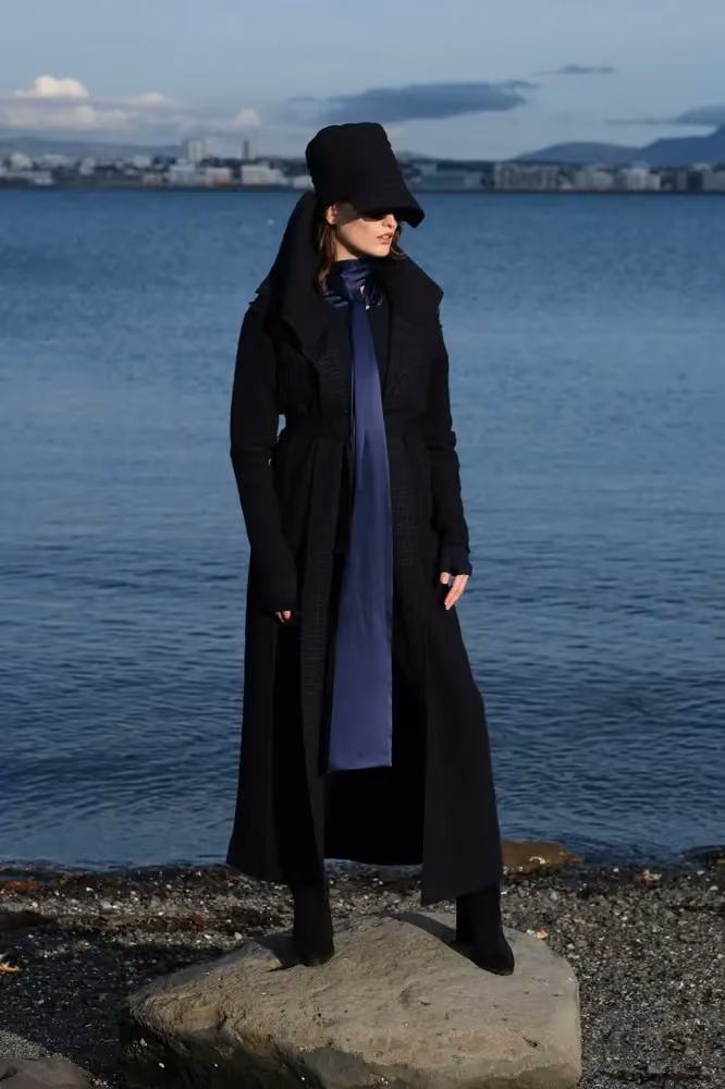 Long black coat with a blue neck scarf — Steinunn Sigurðardóttir, Date not documented