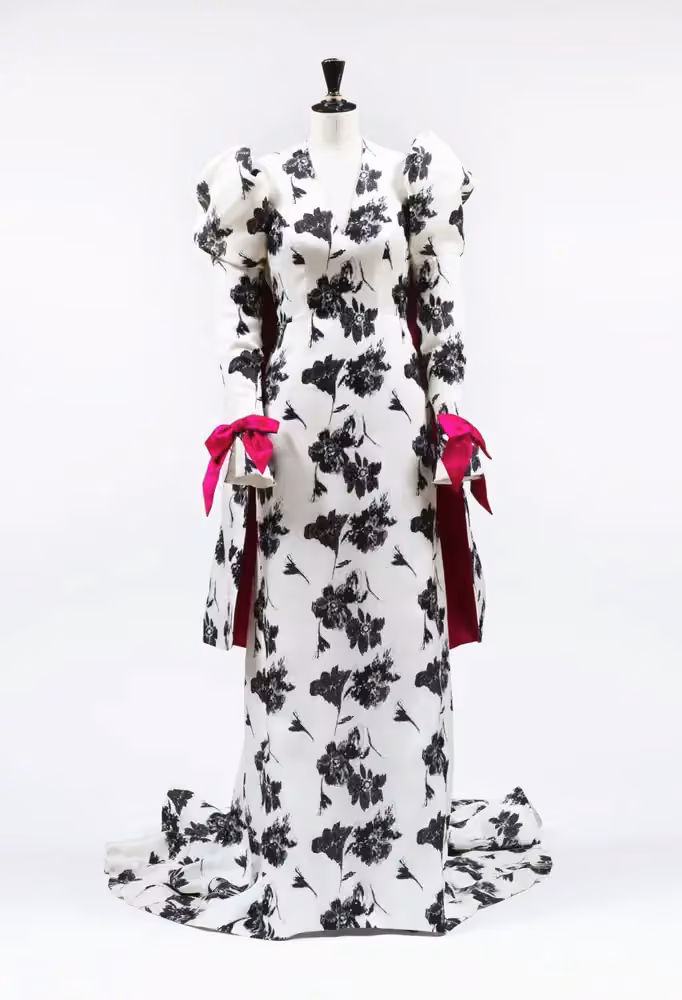 White and black floral Nobel gown with pink bows — Pär Engsheden, 2017