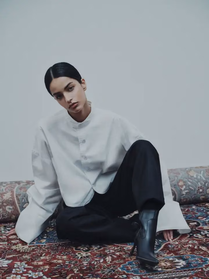 White draped top and black trousers — Ahmed Hassan, Date not documented