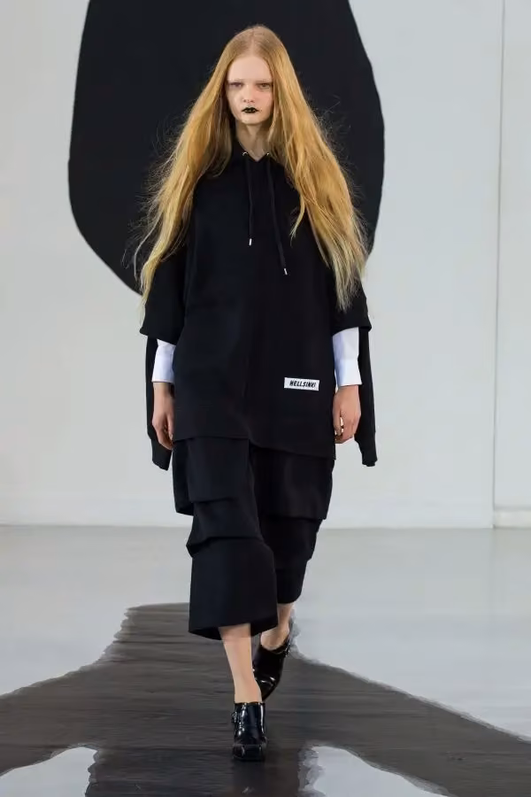Long black coat ensemble — Tuomas Merikoski, Autumn/Winter 2019
